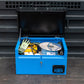 Small blue metal tool box  with a range of electrical tools inside and a yellow hard hat. The toolbox is on the back of a pick up van.